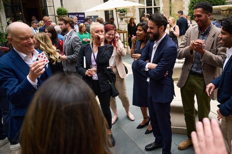 8 Great reasons to book a magician for your corporate event 3 Darren Delaney performing close-up magic at a corporate networking event