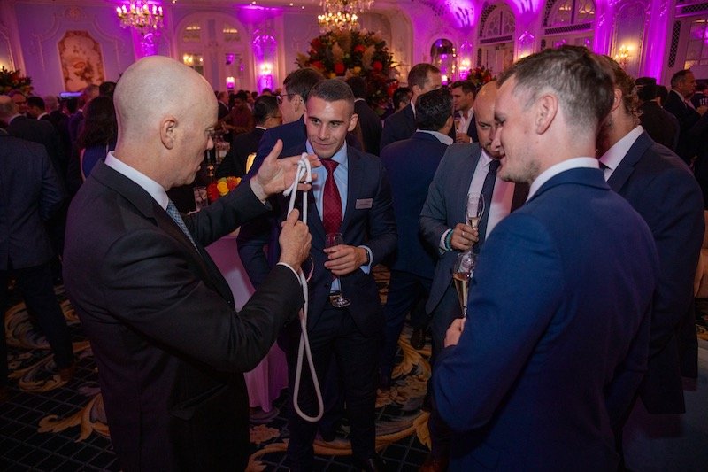 Darren Delaney performing close-up magic in the Lancaster Ballroom at The Savoy Hotel