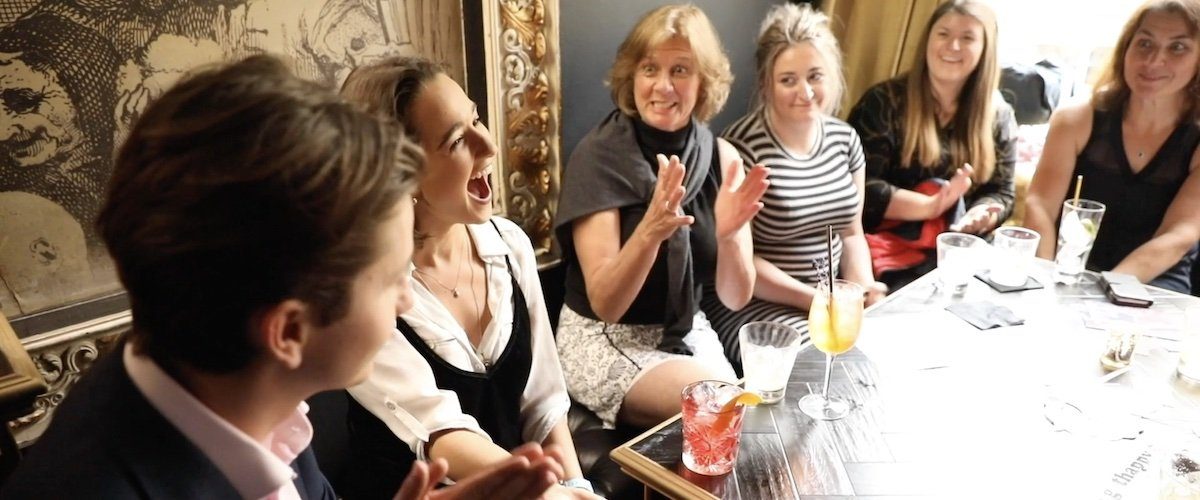people reacting to magic at a corporate event