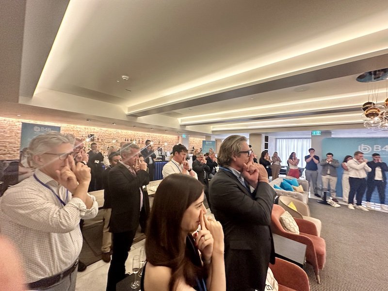Audience at corporate event respond to Darren Delaney's magic performance