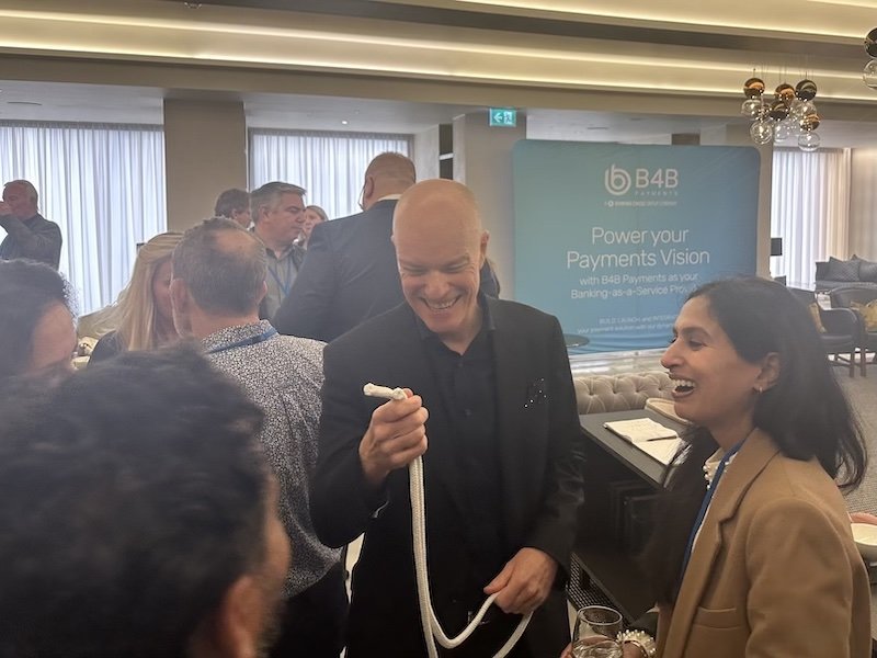 Darren Delaney performing close-up magic during networking drinks at a corporate event