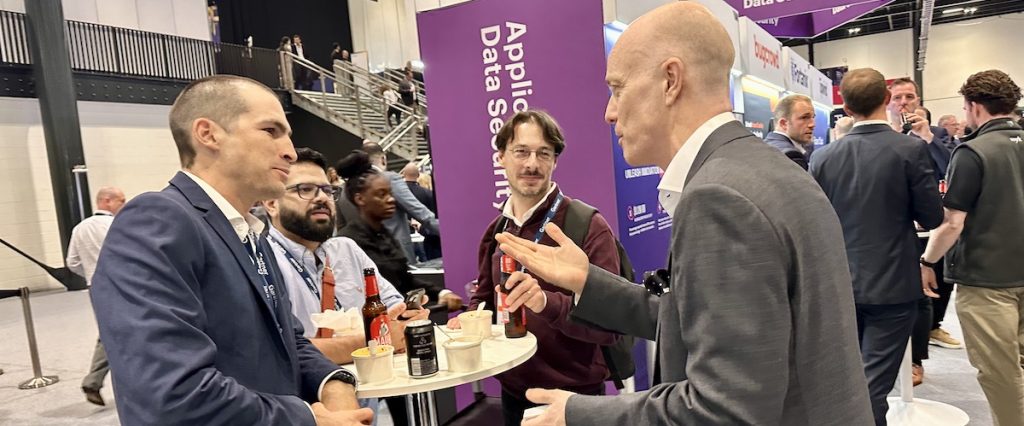 Darren Delaney performing magic at a Gartner trade show at Excel London