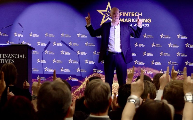 Darren Delaney performing magic onstage at the Fintech b2b marketing awards