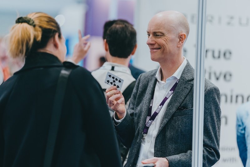 Darren Delaney working as an exhibition magician at Excel London