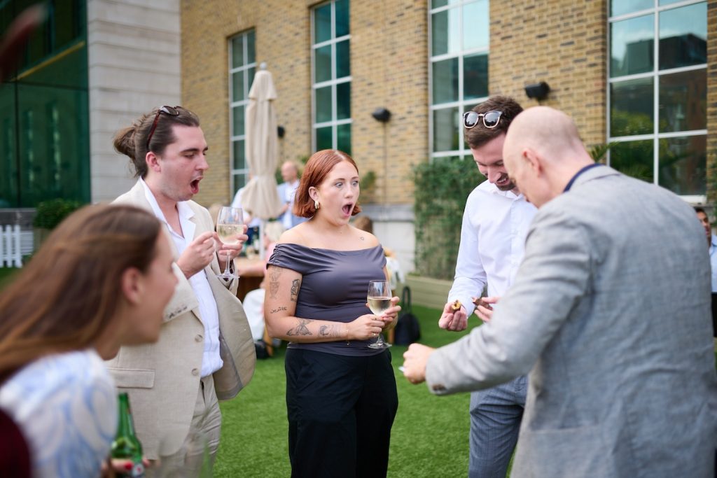 People Reacting to Darren Delaney Magician performing magic at Paytech Awards 2025