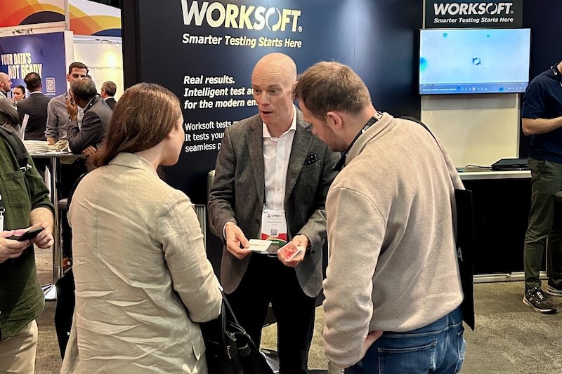 Corporate magician Darren Delaney performing magic on an exhibition booth for a client.