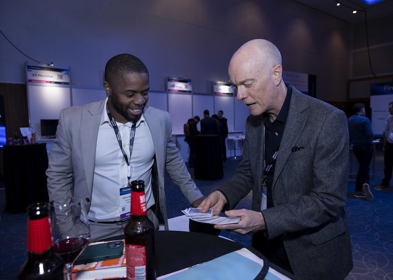Corporate magicianDarren Delaney performing a card trick at Finovate Europe 2026