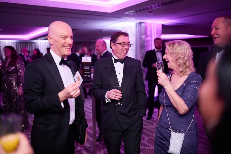 London Magician Darren Delaney performing close-up magic at a corporate black-tie event