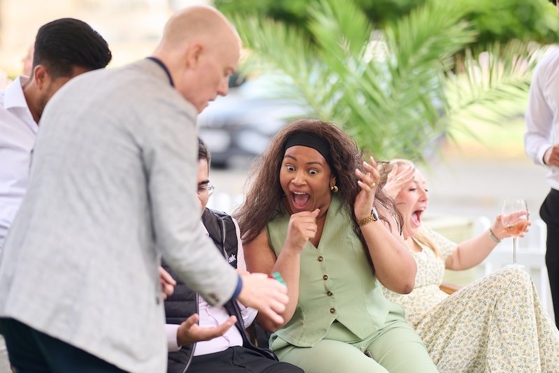 London magician for hire Darren Delaney performing magic at a garden party
