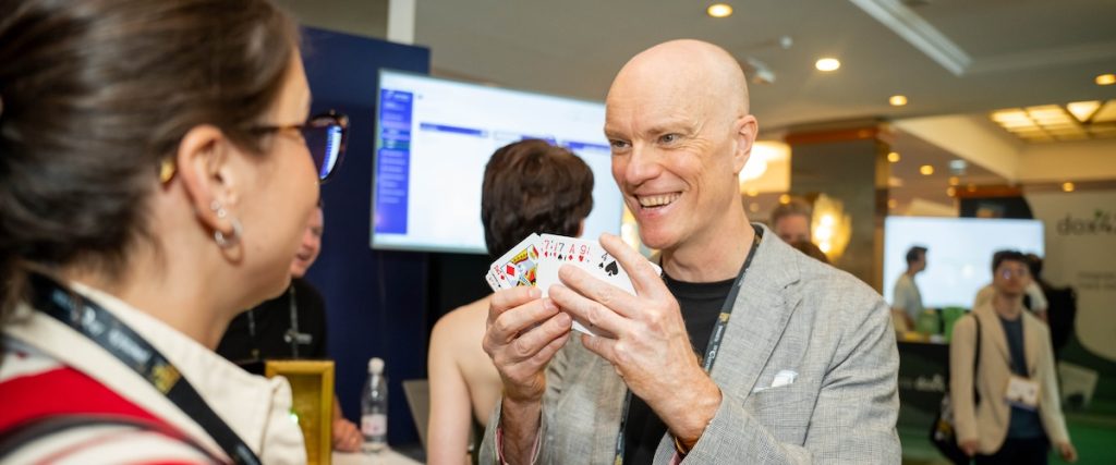 Darren Delaney performing a magic trick at DynamicsMinds 2026 in Portorož, Slovenia