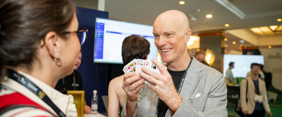 Darren Delaney performing a magic trick at DynamicsMinds 2026 in Portorož, Slovenia