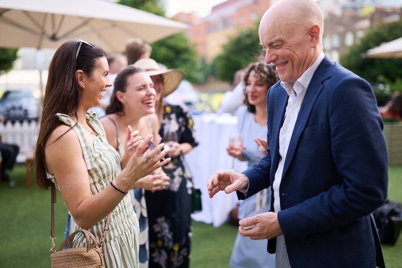 Darren Delaney performing magic at a corporate summer event