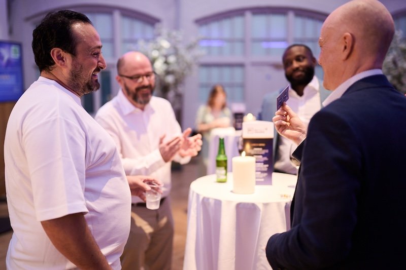 Darren Delaney performing close-up magic at networking drinks